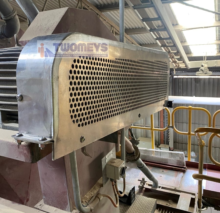 Perforated stainless steel guard fabricated and fitted over a drive coupling on fixed plant