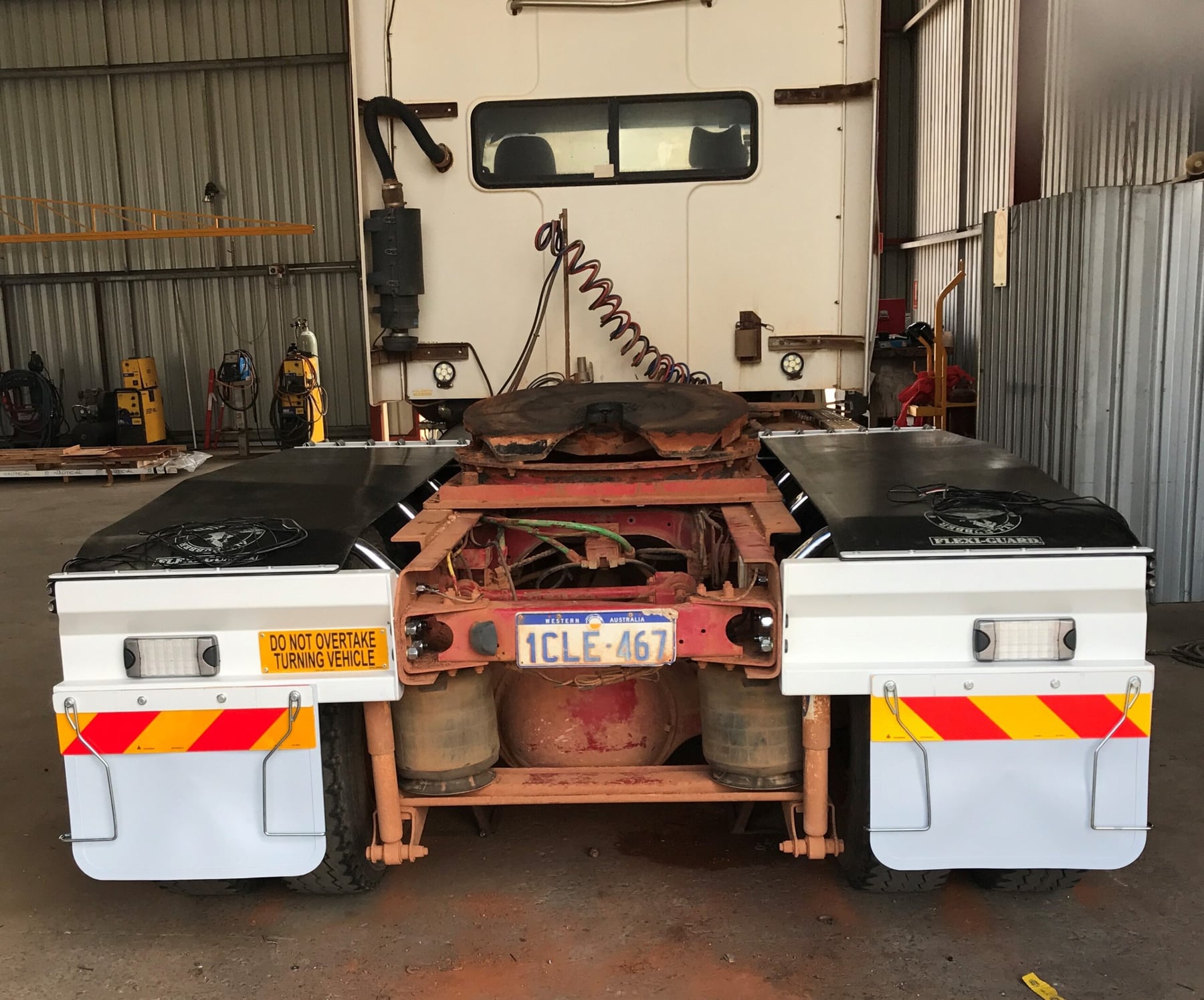 Prime mover fitted with new mudguards and flaps inside the Twomeys workshop