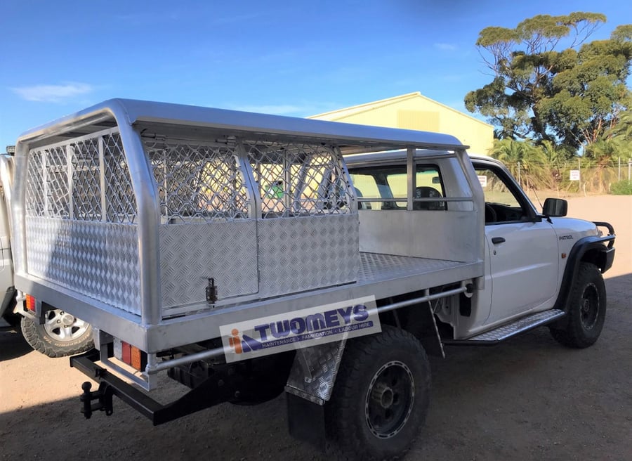 Aluminium mesh canopy with checker plate doors fitted to a white single cab utility